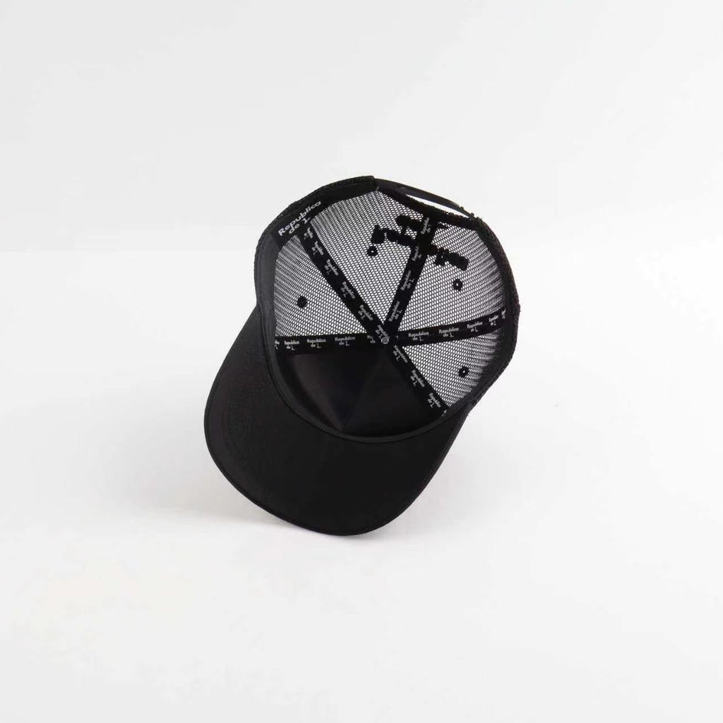 Black cap with a geometric pattern on a white background
