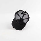 Black cap with a geometric pattern on a white background