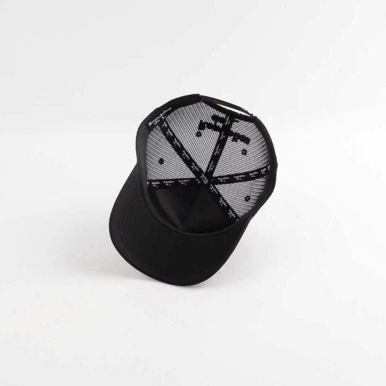 Black cap with a geometric pattern on a white background